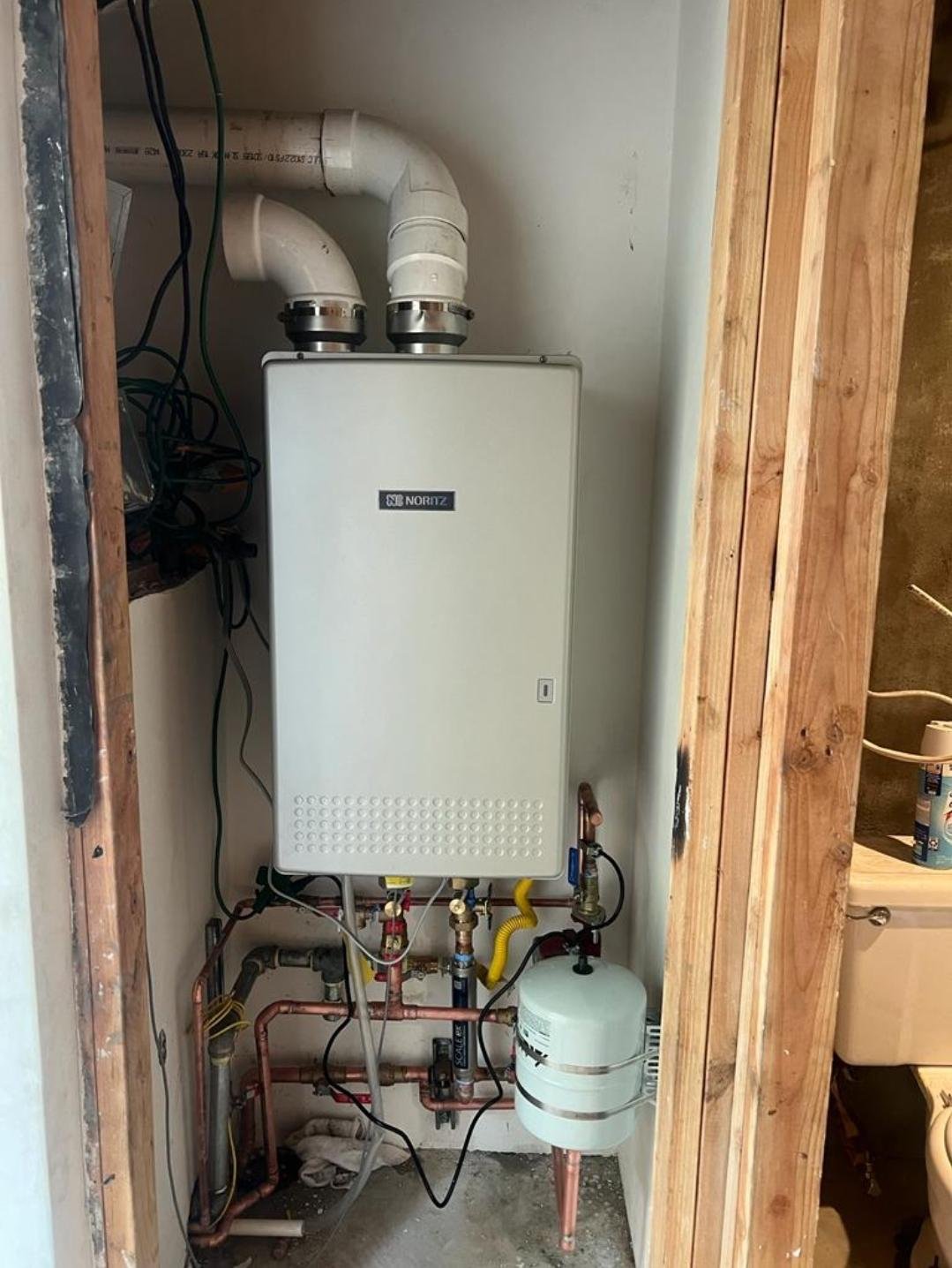 Additional client portfolio photograph of a wall-mounted tankless water heater